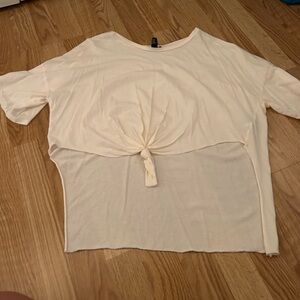 Trendy cropped in front size small t shirt